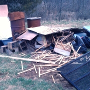 Pile of old broken beekeeping equipment outside